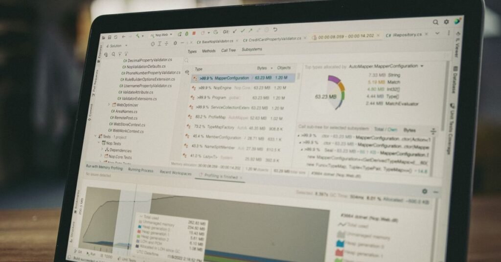 A close-up view of a laptop screen showing a coding and data analysis software interface in an indoor setting.