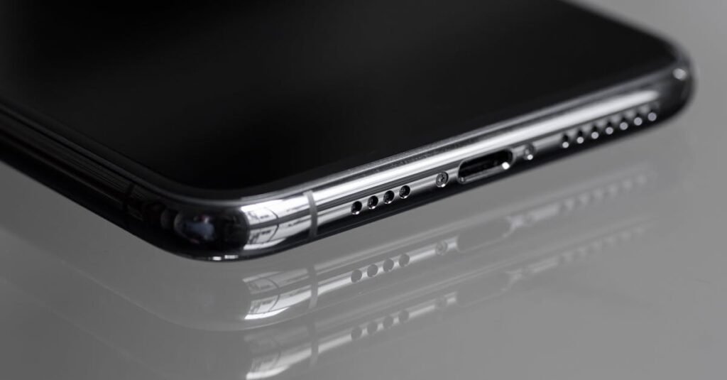 Detailed close-up of a smartphone's edge with a reflective surface, emphasizing sleek design.