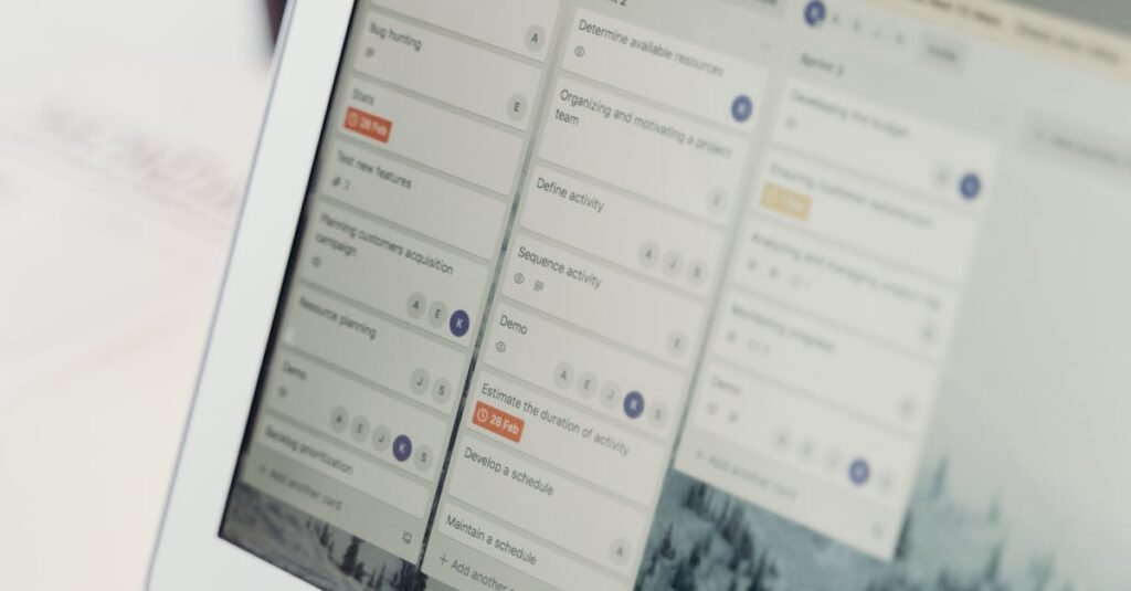 Close-up of a laptop screen showing project management software interface. Perfect for business or tech themes.