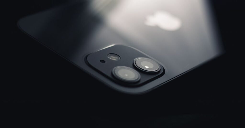 Close-up shot of a smartphone camera lens reflecting light, highlighting modern technology.