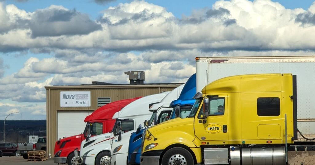 Parked semi-trucks of various colors outside a Nova Parts warehouse in Truro, NS.