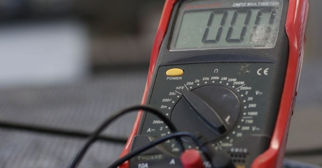 Professional multimeter with wires that combining functions of voltmeter ammeter ohmmeter placed on floor