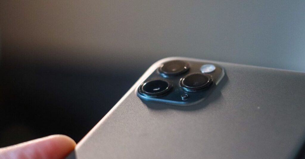 Detailed view of a modern smartphone's triple camera setup in focus.