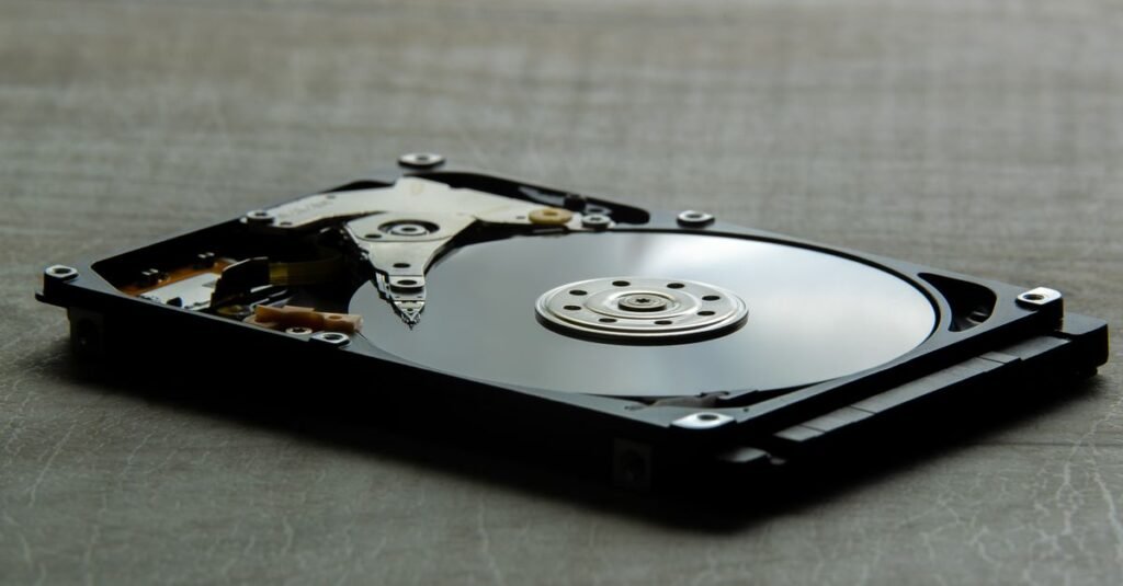Detailed view of an open hard disk drive showing its internal components.