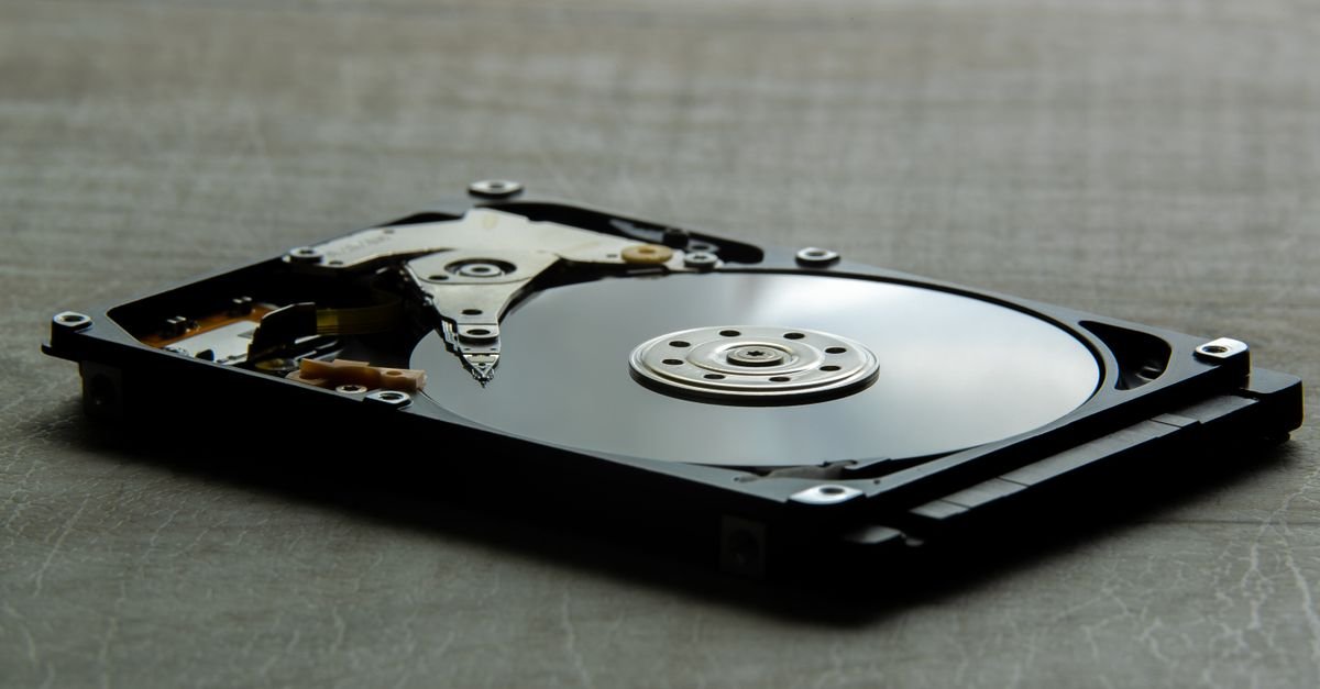 Detailed view of an open hard disk drive showing its internal components.