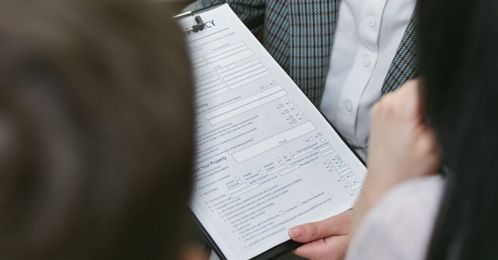 Close-up of professionals discussing a legal contract during a business meeting.